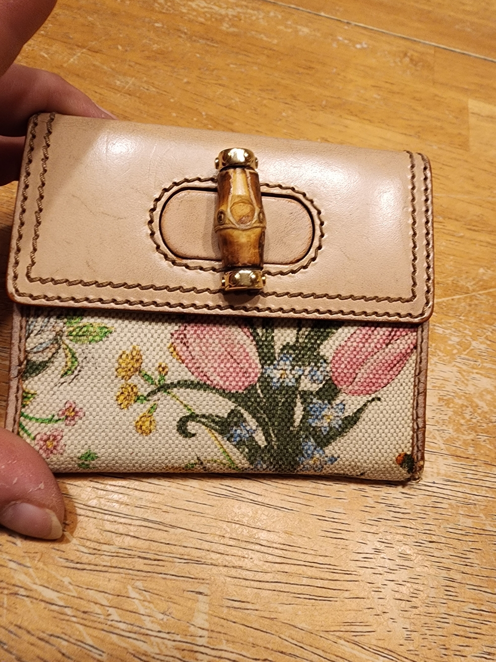 Gucci Flora Bamboo Wallet featuring a distinctive bamboo twist-lock closure